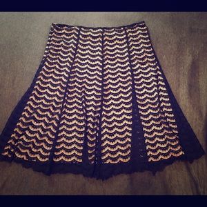 Lace skirt with nude under skirt.
